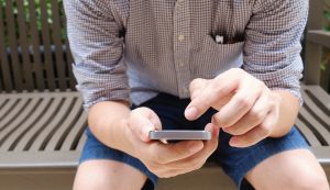 a young person using a mobile phone