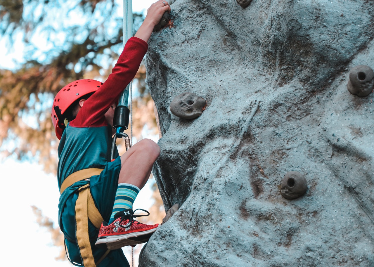 a child rock climbing